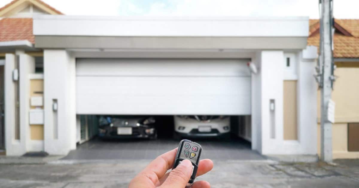 How do I add or reprogram a hand-held garage door remote control?